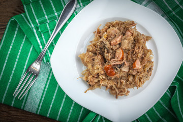 Traditional polish sauerkraut (bigos) with mushrooms and meat.