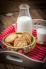 Stack of freshly baked oat biscuits in a bowl.