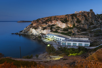 Boat houses in fishing village of Goupa on Kimolos island in Greece.
