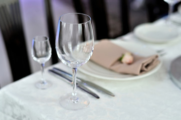 Empty transparent glasses on a festive table