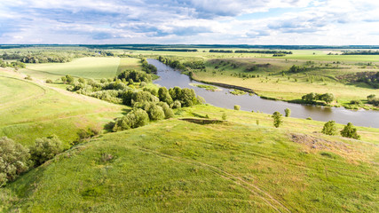 Fototapeta na wymiar A landscape of hills with a river
