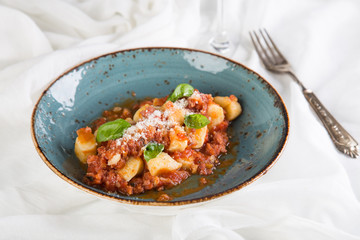Italian gnocchi with sausage and tomato sauce 