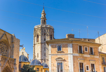 Fototapeta na wymiar Tower and blue domes of the cathedral of Valencia