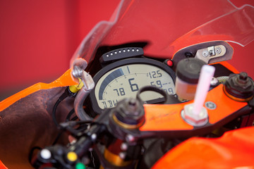 The dashboard with the speedometer on the instrument panel of the motorcycle closeup