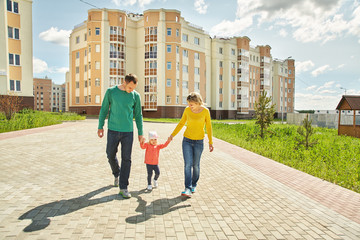 happy playing family outdoors