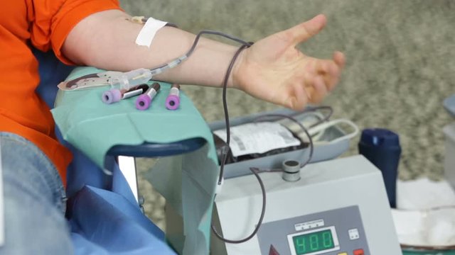 Blood donation hand. Blood bag
