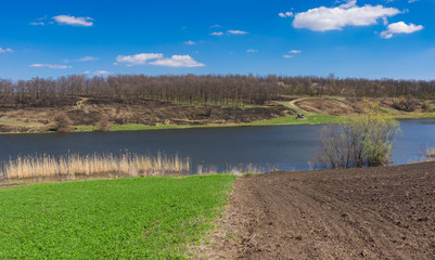 Panoramic spring landscape with Suha Sura river in Vasylivka village near Dnepr city, central Ukraine