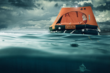 Fototapeta premium life raft floating on the sea