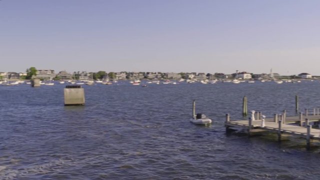 Camera Pans To Show Off View Of Beautiful Nantucket Island's Town Harbor, From Boat