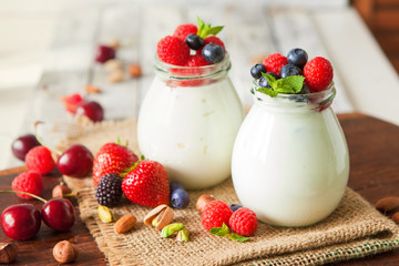 Natural yogurt with fresh berries and nuts