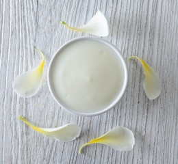 yogurt in white bowl on wood