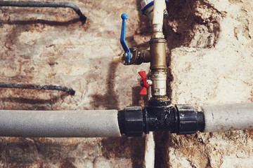 Old plumbing and water pipes - obrazy, fototapety, plakaty