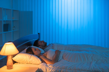 The man and woman sleeping in the bedroom. night time