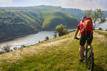 Adventure mountain biking on riverside