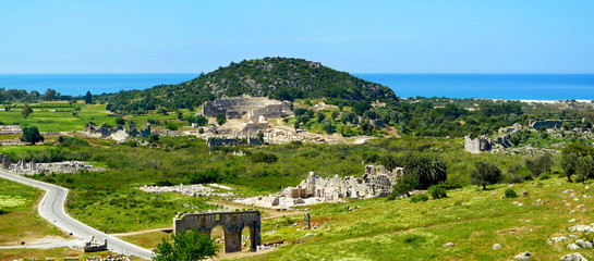 Obraz premium Antique ruins, amphitheatre and gate near Patara beach,Turkey.