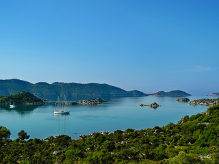 Beautiful view of the bay with floating yacht and Kekova Island on the background, Demre district, Turkey