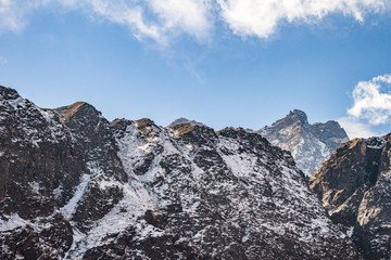 Close up shot of Black mountain with snow and cloud on the top at Thangu and Chopta valley in winter in Lachen. North Sikkim, India.