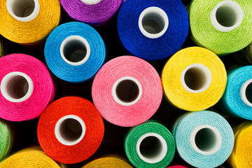 Top view close up of threads spools colorful bright tone background