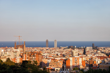 Fototapeta premium Barcelona cityscape at sunset, horizon of Mediterranean Sea, Catalonia, Spain