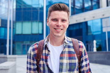 Close-up of boy in headphones listens music