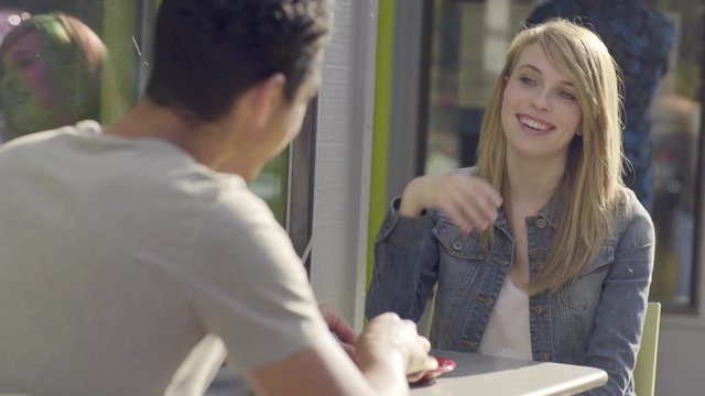 Man Tries To Steal A Bite Of His Girlfriend's Cookie, She Slaps His Hand Away As A Joke, Then Shares With Him 