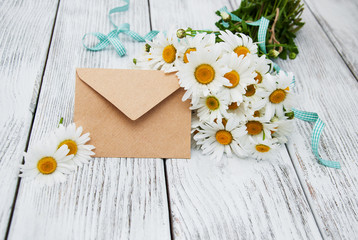 bouquet of daisies with envelope