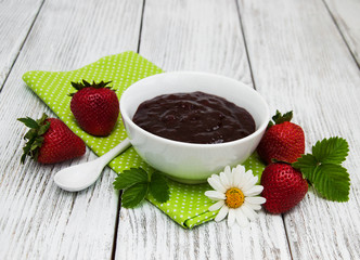 Strawberry jam and fresh strawberries