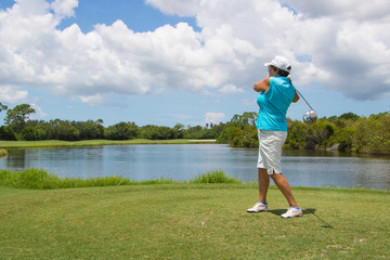 Golfer Hitting Ball on Beautiful Golf Course
