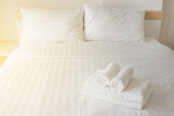 Fototapeta na wymiar Towel on the bed in the hotel