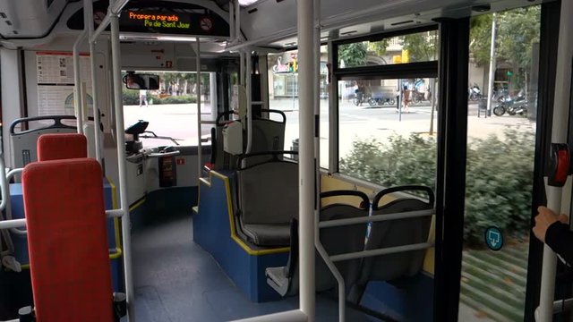 Empty seats in a Barcelona public bus during the day