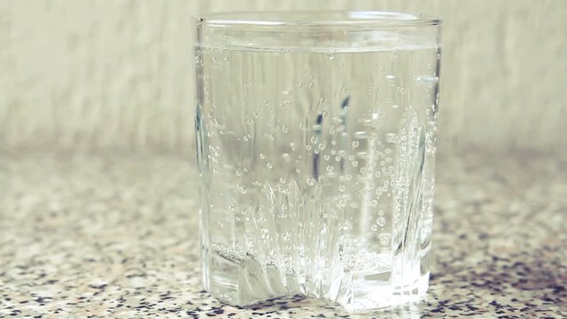 Glass with mineral water closeup