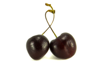 Two cherries isolated white background