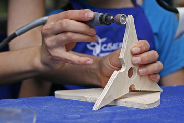 Teaching a child woodcarving