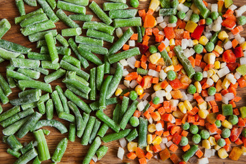 Frozen asparagus and dietary mix for cooking. Vegetables assortment on cutting board, salad cooking...