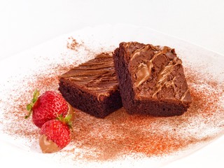Chocolate brownie cake on white background with strawberry