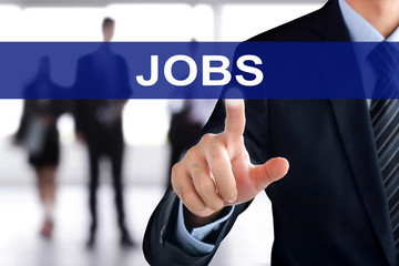 Businessman hand touching JOBS sign on virtual screen