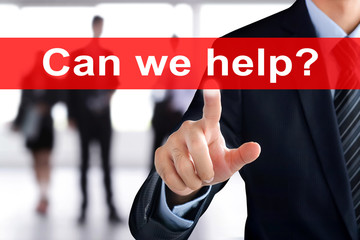 Businessman touching  Can we help? sign on virtual screen