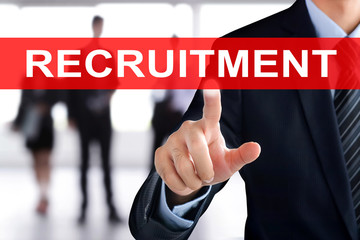 Businessman hand touching  RECRUITMENT sign on virtual screen
