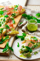 PEA PROSCIUTTO SPRING PIZZA . Top view. selective focus