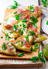 PEA PROSCIUTTO SPRING PIZZA . Top view. selective focus