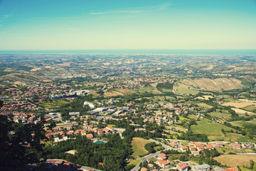 Panorama of Republic of San Marino and Italy from Monte Titano, City of San Marino. City of San Marino is capital city of Republic of San Marino located on Italian peninsula, near Adriatic Sea.