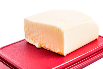 Butter in red  butter dish isolated on white 