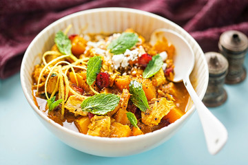 Moroccan tajine - fried chicken with pumpkin cranberries, feta and mint
