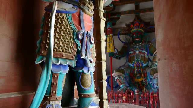 Chinese immortals Buddhist samurai Vajra sculpture in carved beams painted buildings,ancient door.