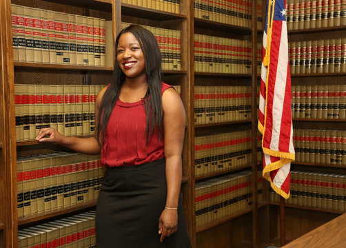 Portrait of attractive young African American female lawyer, law office