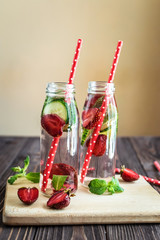 Detox water infused with fruits. Summer water fruit on rustic background