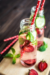 Detox water infused with fruits. Summer water fruit on rustic background