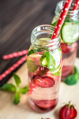 Detox water infused with fruits. Summer water fruit on rustic background