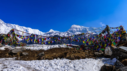 Prayer flags and Mt. Annapurna I background from Annapurna Base Camp ,Nepal.