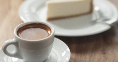 espresso and cheesecake on table